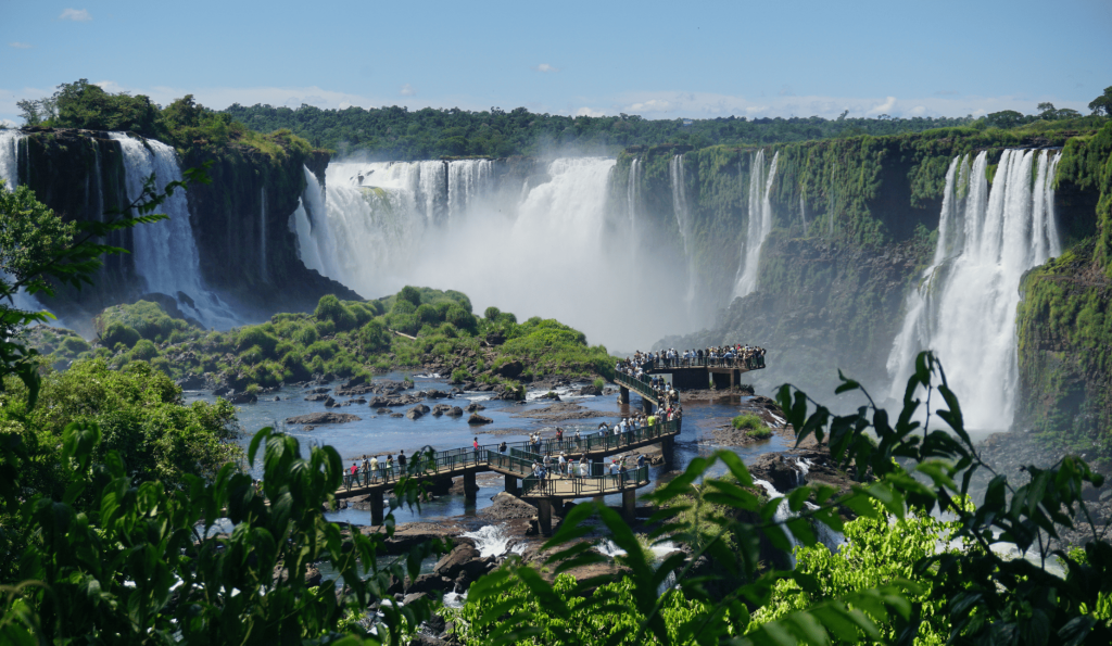 Iguaçu Falls in all its grandeur, with rainbows forming in the waterfalls.